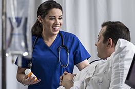 Nursing student talking to a patient