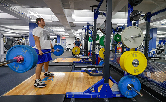 A gym member using the Rack platform