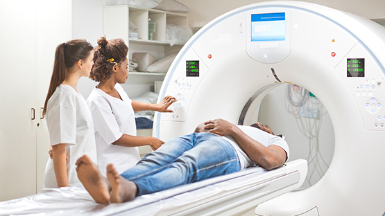 Technicians doing a Magnetic Resonance Imaging test.